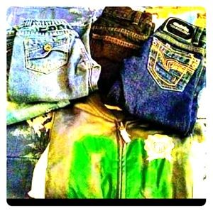 Three sets of toddler jeans , an a track jacket